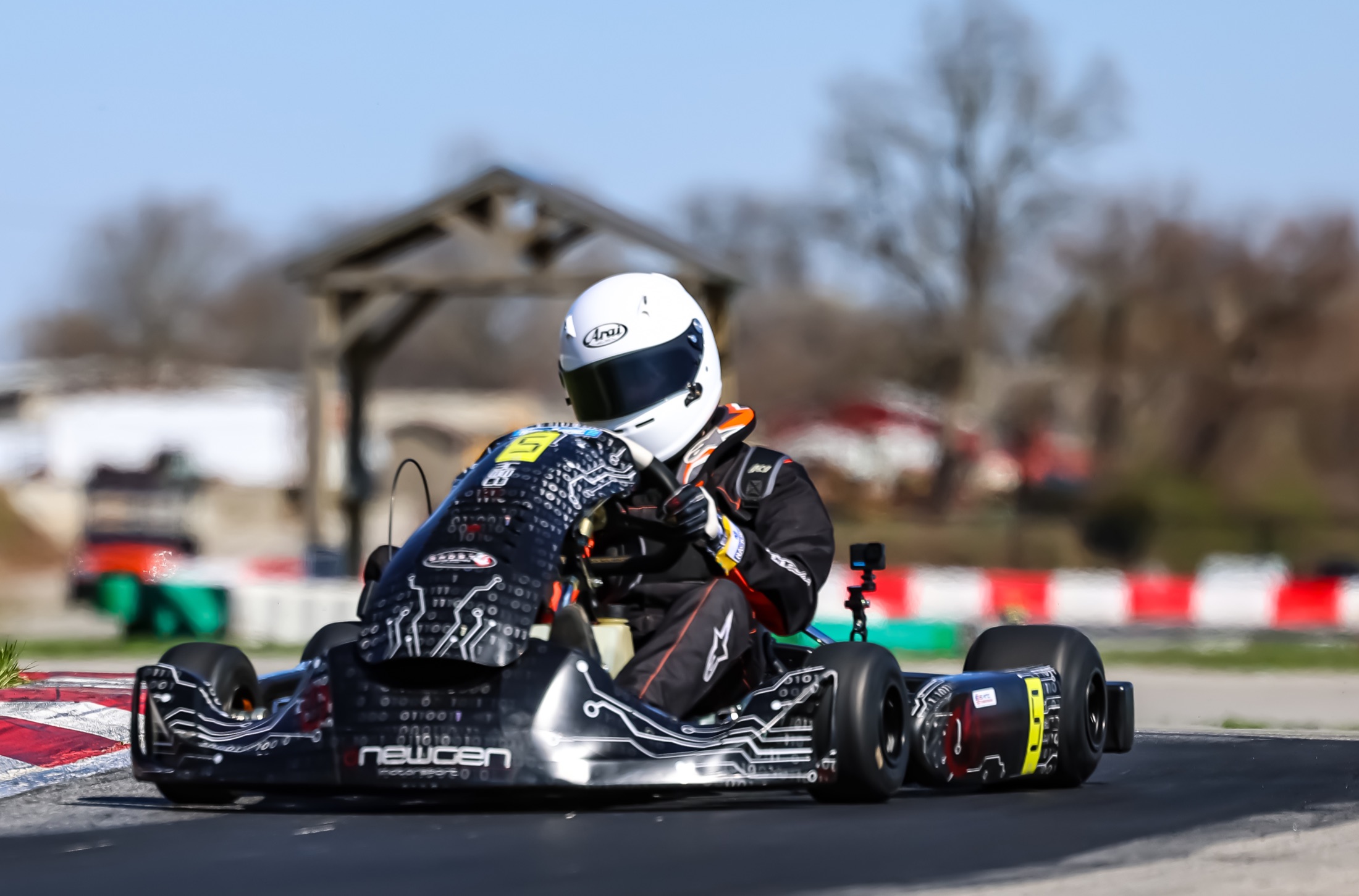 Emmett King leaning into a corner in the number 5 kart