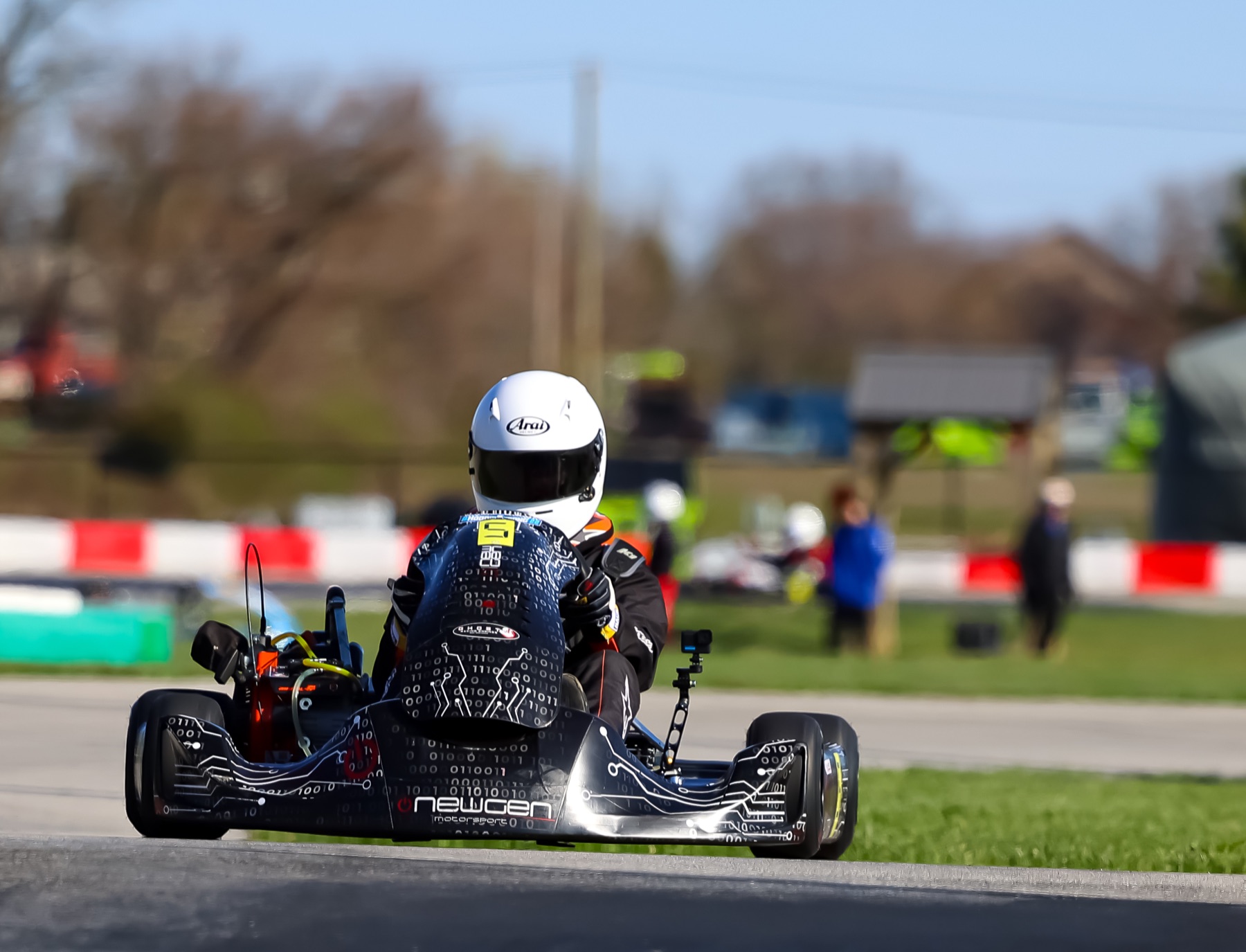 Front view of Emmett King driving the Newgen kart