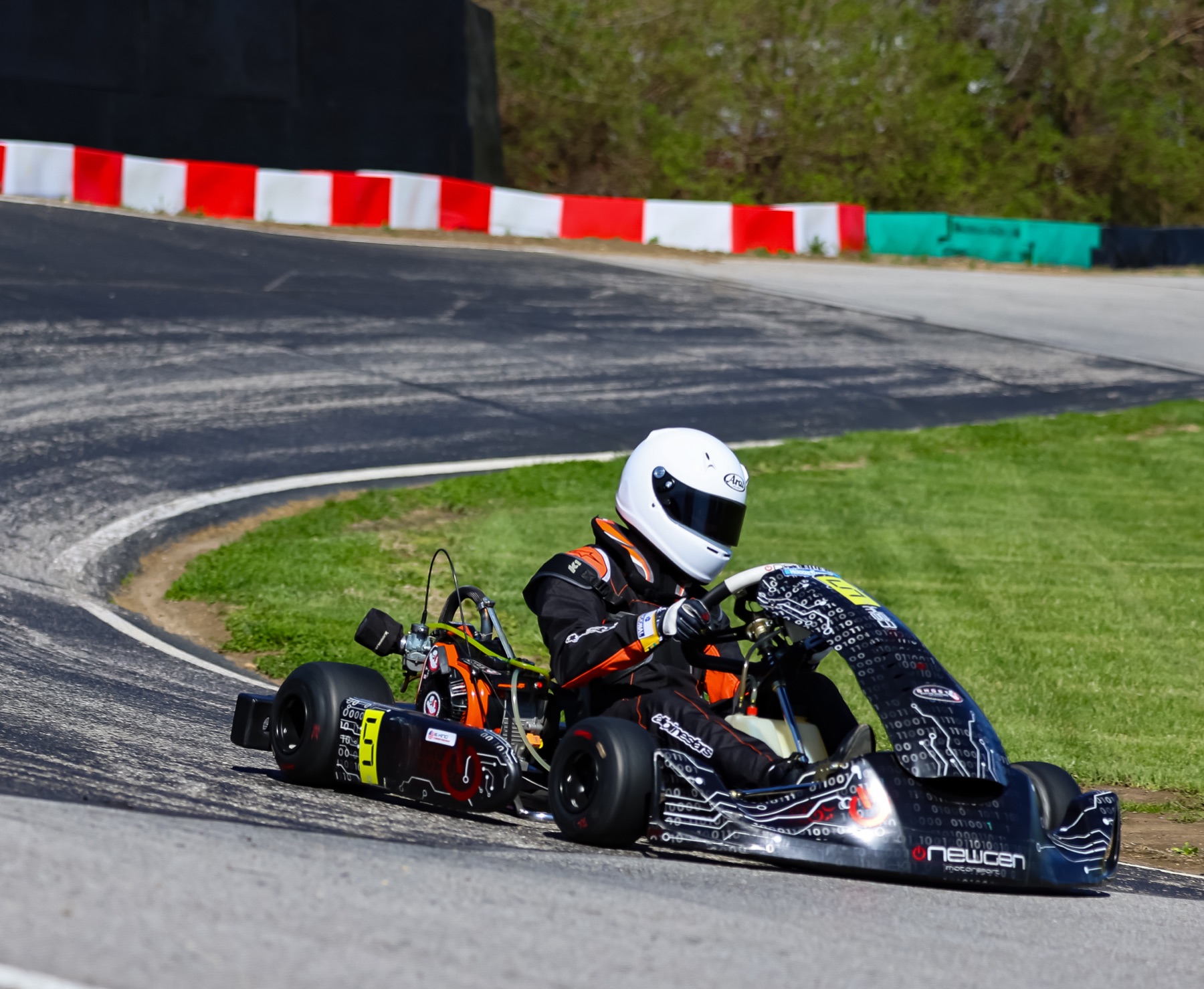 Emmett King in the number 5 kart through a track bend