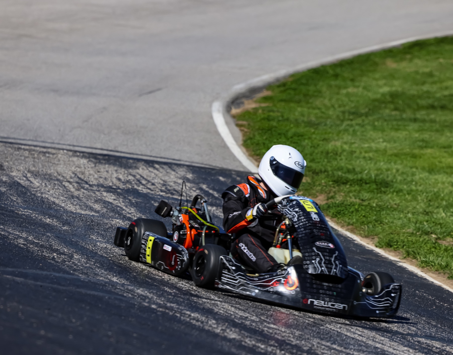 Emmett King steering the number 5 kart through a sweeping corner