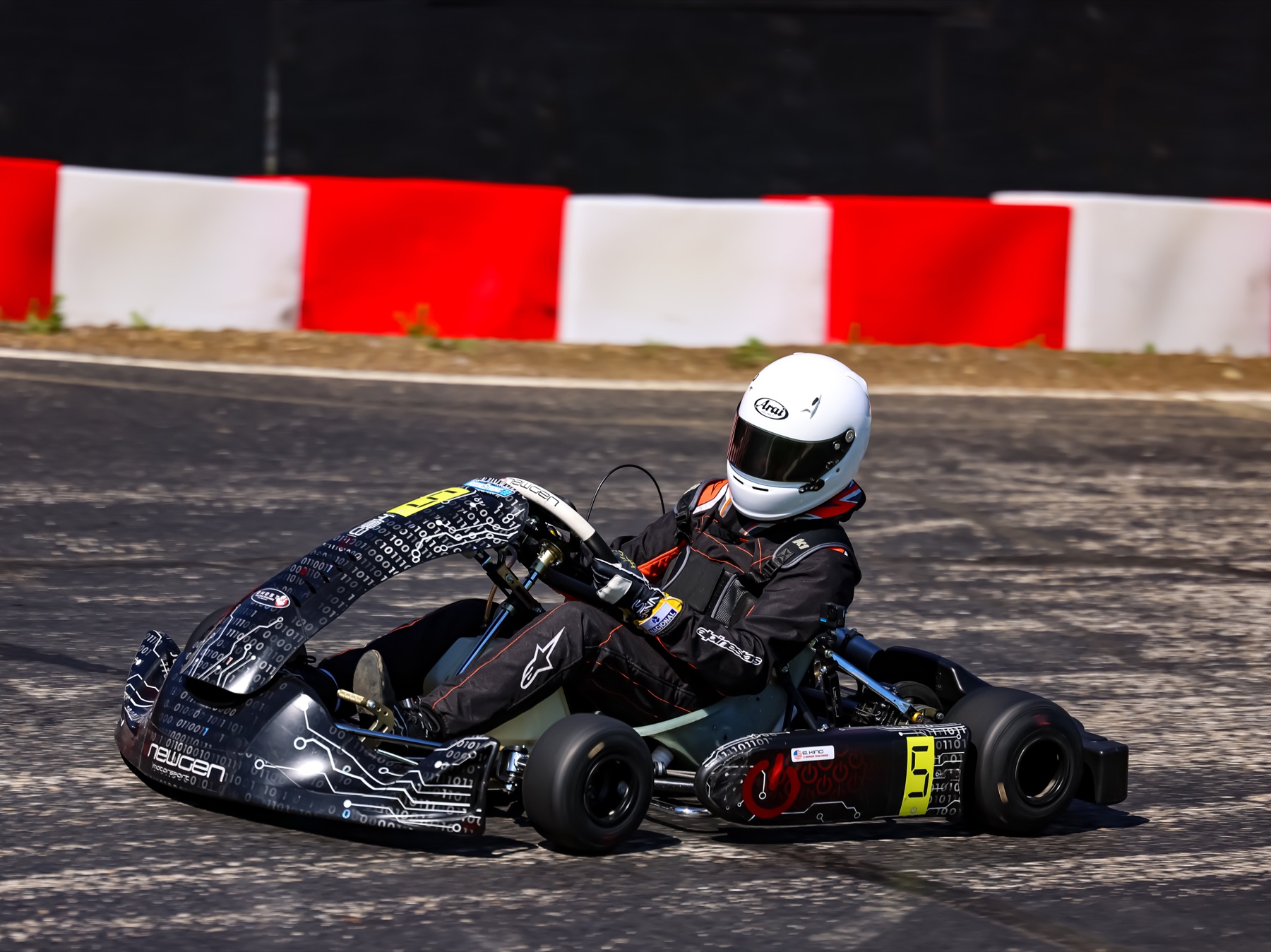 Side profile of Emmett King in the number 5 kart